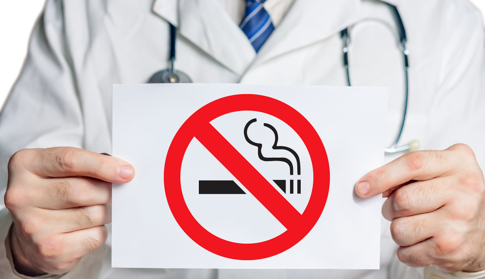 Doctor with a stop smoking sign